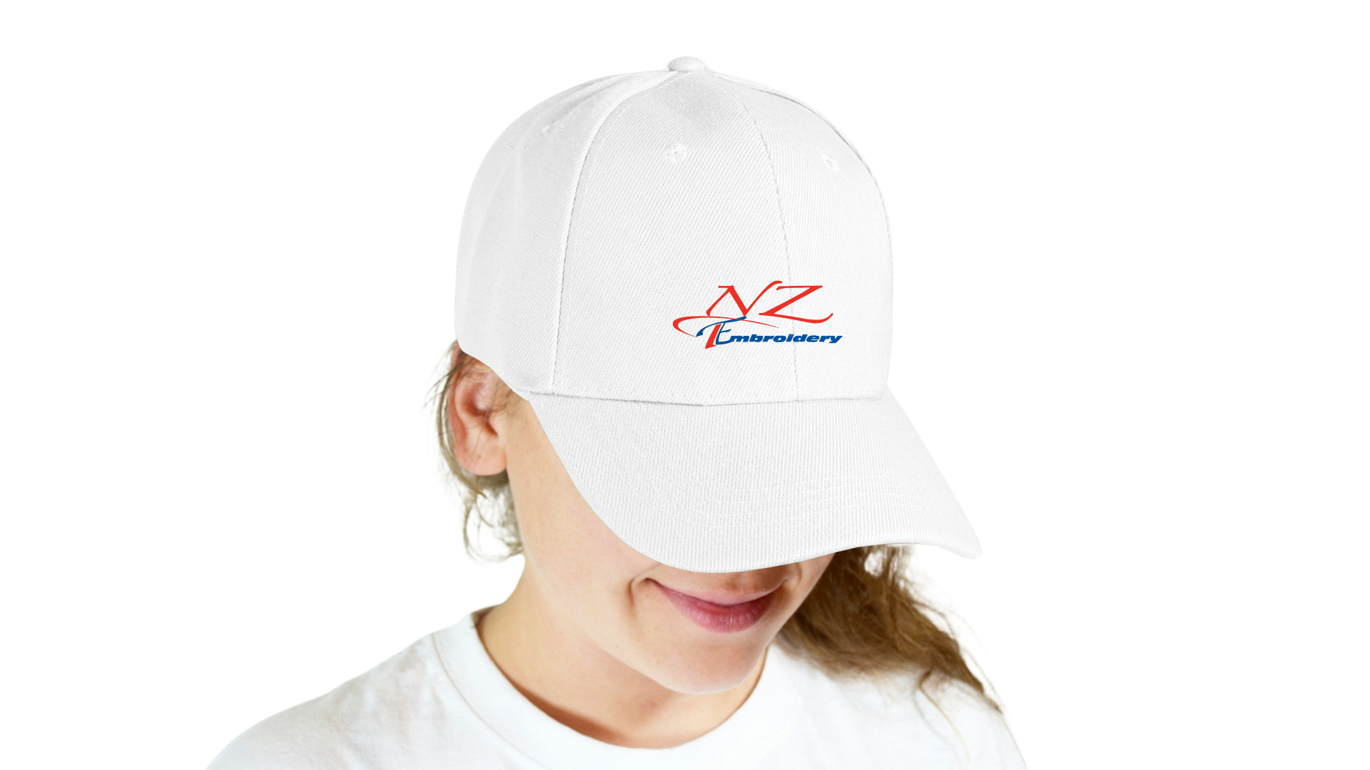 A girl with a cap with a logo of the company NZ Embroidery